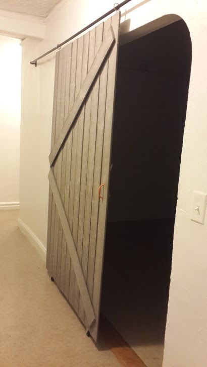 Sliding barn door from Remodelaholic tutorial Cheap Room Dividers, Temporary Room Dividers, Small Room Divider, Room Divider Bookcase, Fabric Room Dividers, Diy Sliding Door, Portable Room Dividers, Glass Room Divider, Bamboo Room Divider