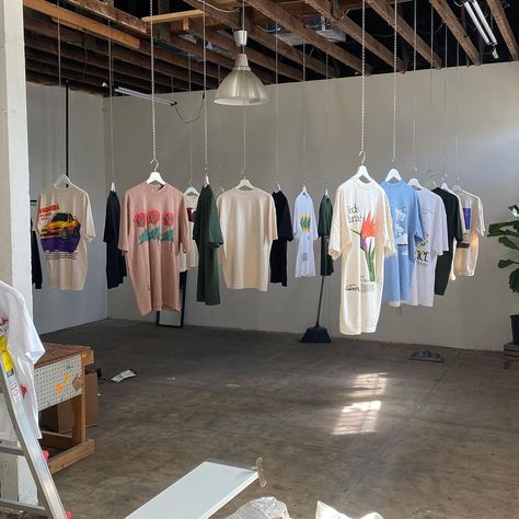 Clothing Brand Interior Design, Clothing Store Pop Up, Print Shop Aesthetic, Streetwear Pop Up Shop, Clothing Brand Astethic, Merch Photoshoot Ideas Studio, Pop Up Shop Aesthetic, Clothing Designer Aesthetic, Clothing Brand Office