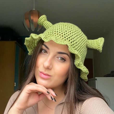 Handmade green crochet Shrek Hat! I made this originally for myself for a funny hat party, and it went a bit crazy on Instagram stories so I've added it to my site for you all to buy! If you love Shrek then this is the perfect little green bucket hat for you - perfect for fancy dress Fiona or Shrek looks and complete with frilled edges so you'll still look 10/10 cute. Choose between 3 Shrek-ky shades of green! I would recommend regular for most people as they are quite stretchy, but if you have quite a large head and/or curly hair that's quite full then I'd go for a large. It's impossible to make these without smiling, I hope you love them as much as I do! <3 Crochet Shrek Hat, Boyfriend Crochet, Shrek Crochet, Crochet Shrek, Shrek Hat, Green Bucket Hat, Crocheted Stuff, Hat Party, Crazy Hats