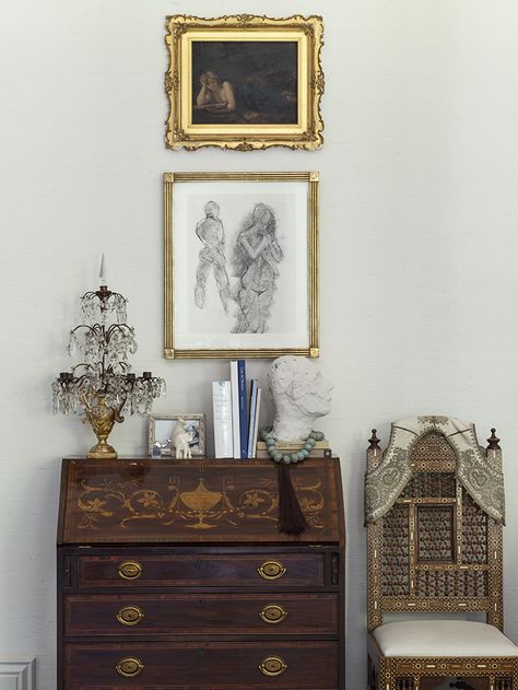 Ornate wooden hutch and chair agaist cream colored wall with framed wall art. Wooden Secretary Desk, Secretary Desk Decor Ideas, Secretary Desk Decor, Antique And Modern Mix Decor, Desk Decor Ideas, Vintage Secretary Desk, Eclectic Glam, Antique Secretary Desks, Antique Desks