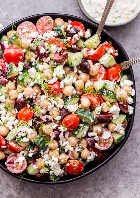 This quick and easy Greek Chickpea Salad with Tzatziki Dressing is great for a vegetarian lunch or dinner. Everything you find in a Greek salad, minus the lettuce and tossed in a creamy, flavorful tzatziki dressing. #salad #greeksalad #chickpeas #vegetarian #glutenfree #tzatziki #dressing Vegetarian Tzatziki Bowl, Essen, Salads With Tzatziki Sauce, Greek Salad Bowl Recipe, Tzatziki Sauce Salad, Greek Salad With Tzatziki Sauce, Chickpea Greek Bowl, Chickpea Lentil Salad, Recipes With Tzatziki