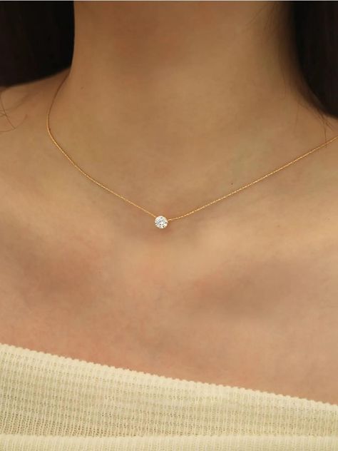 Elevate your everyday style with this Dainty Minimalist Solitaire Zircon Charm Necklace for Women, a perfect blend of simplicity and elegance. This beautiful necklace features a brilliant solitaire zircon stone, meticulously set in a delicate gold-tone chain that exudes understated luxury. The minimalist design highlights the sparkling zircon charm, making it a versatile piece that can effortlessly complement both casual and formal outfits. Crafted with high-quality materials, this necklace offers long-lasting durability while maintaining its subtle yet sophisticated shine. The solitaire zircon pendant symbolizes purity and clarity, making it an ideal choice for women who appreciate timeless, minimalist jewelry. This dainty zircon necklace is perfect for layering with other necklaces or we Minimalistic Necklace, Necklace Diamond Pendant, Diamond Gold Pendant, Cz Stone Necklace, Gold Bride Jewelry, Diamond Solitaire Necklace, Solitaire Necklaces, Necklace Diamond, Bride Jewellery