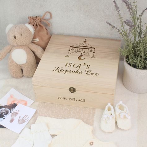 Introducing our charming Personalised Baby Keepsake Boxes, the timeless and thoughtful way to cherish and preserve your little one's most precious memories! 🤱 Adorned with a delightful baby mobile illustration, our wooden baby memory box is a perfect addition to any nursery or home, showcasing a blend of charm and practicality. With six sizes to choose from, including the 24cm, 27cm, and 30cm rectangular options, as well as medium and large square variations, you can select the ideal size fo... Pregnancy Keepsake Ideas, Baby In Present Box Photo, Mobile Illustration, Personalised Baby Gifts Embroidery, Personalised Storage Box, Baby Luxury, Baby Boy Keepsake Box, Luxury Baby Shower, New Parents Gift