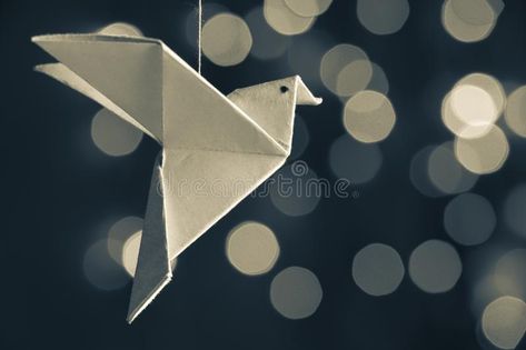 Photo about Japanese traditional origami bird flying in a bokeh light grayscale background. a symbol of freedom, an expression of unity in diversity. Image of learning, hope, light - 131284253 Origami Photography, Paper Elephant, Display Photography, Hope Light, Symbol Of Freedom, Bird Flying, Green Circle, Origami Bird, Symbols Of Freedom