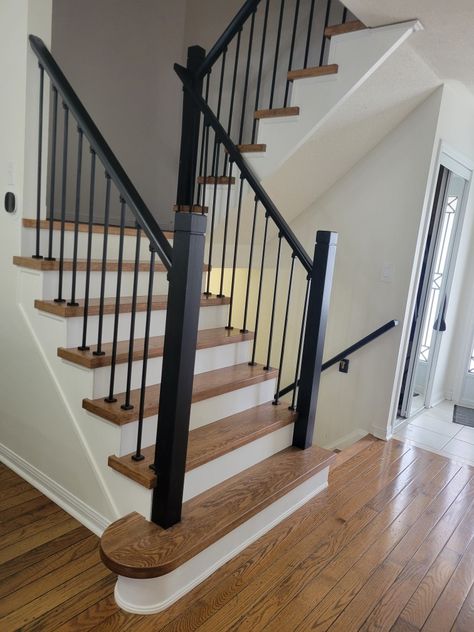 Black Railing Wood Stairs, Farmhouse Black Staircase, White Stairs Black Metal Railing, White Oak And Black Staircase, Black Spindle Staircase, Black Railing Stairs Banisters, Stair Railing Ideas Black, Stairs Black Railing, Black Handrails For Stairs