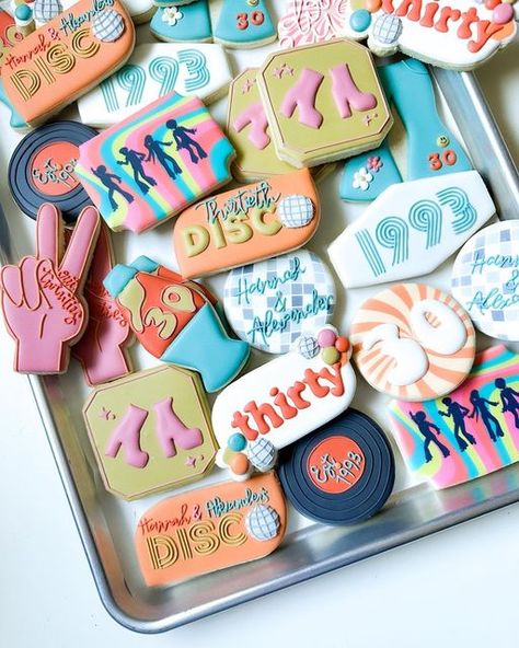 Morgan McShan on Instagram: "Pick a favorite…. I think mine is the Disco ball cookies… printed with Eddie from a clip art from Canva 🪩💃🏼🕺 • • • • #discocookies #groovycookies #groovybirthday #discobirthdayparty #houstontreats #houstonsmallbusiness#texascookier #houstoncookier #royalicingcookies #decoratedsugarcookies #cookiedecorating #houstoncookies #houstonsugarcookies #houstonbusiness #houstonbaker #houstoneats #houstonblogger #girlboss" 70s Themed Birthday Cookies, 70s Theme Cookies Decorated, Disco Party Cookies Decorated, Disco Cookies 70s, 70s Cookies Decorated, Abba Cookies, Disco Themed Cookies, Disco Birthday Cookies, Disco Ball Sugar Cookies