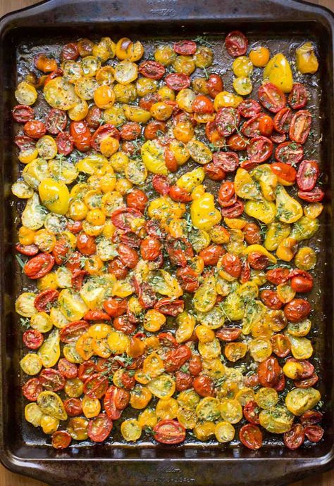 Garlic Herb Roasted Tomatoes - these incredibly flavorful roasted tomatoes are wonderful in salads, pasta dishes, on pizzas, sandwiches and a myriad of other uses! thecafesucrefarine.com Sheet Pan Tomatoes, Use Fresh Tomatoes, Pan Roasted Tomatoes, Baby Tomatoes Recipes, Tiny Tomatoes Recipes, Small Tomatoes Recipes, Roasted Cherry Tomatoes Oven, Currant Tomatoes, Roasted Tomatoes And Feta