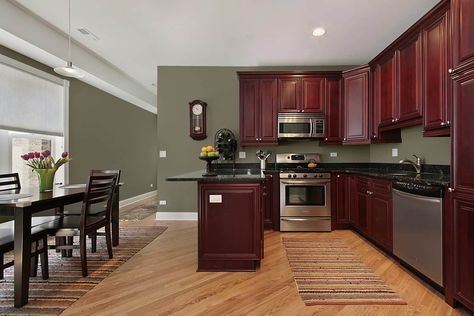 10 Best Wall Paint Colors that go with Cherry Cabinets Kitchen Paint Colors With Cherry, Cherry Wood Kitchen Cabinets, Popular Kitchen Colors, Best Wall Paint, Cherry Wood Kitchens, Dark Brown Cabinets, Cherry Furniture, Paint For Kitchen Walls, Brown Kitchen Cabinets