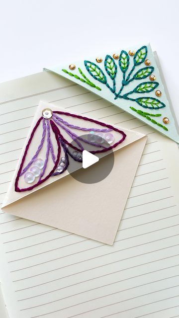 Sara Pastrana | Embroidery Artist on Instagram: "Some crackling sounds for you today 🙉 as I assemble a paper embroidery corner bookmark. I add a piece of tracing paper to the back of the embroidery so it’s able to glide on to the book pages. 

#paperembroidery #embroideryonpaper #embroiderybookmark" Book Corner Embroidery, Corner Bookmarks Paper, Embroidery Corner Bookmark, Thread Crafts, Corner Bookmark, Corner Bookmarks, Book Corners, Tracing Paper, Paper Embroidery