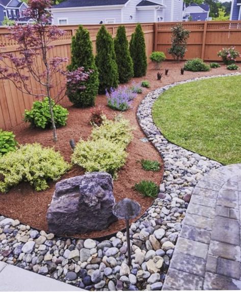 Backyard Landscaping Corner Ideas, Rock Flower Beds Backyard Designs, Landscaping Ideas For Front Of House With Rocks, Rock Garden Along Fence, Stone Front Yard Landscaping, Rock Edge Landscaping, Simple Clean Landscaping Front Yards, Plants Around Patio Edge, Rock Wall Garden Ideas