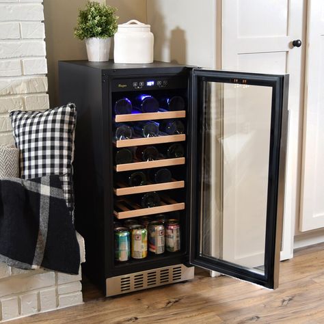 This slim wine and beverage fridge is designed to fit in small spaces and chill your wine to perfection. The beverage refrigerator features a modern design and is built to last from a steel construction, glass door, and modern handle. The fridge can accommodate up to 33 bottles of wine and can also hold bottles or cans of soda, water, or beer. Use the stainless steel handle to open the layered glass door and slide the beech wood shelves out one by one to select your drink of choice. Grill ventilation is located on the bottom front of the fridge and a touchpad controller with LED display helps complete the modern style. The touchpad can be used to adjust the temperature to the desired level to enjoy optimally chilled wine and other drinks. Built to last, this fridge also features compressor Wine Refrigerator Ideas, Drinks Soda, Refrigerator Ideas, Beverage Fridge, Sliding Shelves, Beverage Refrigerator, Kitchen Redesign, Soda Water, Stainless Steel Grill