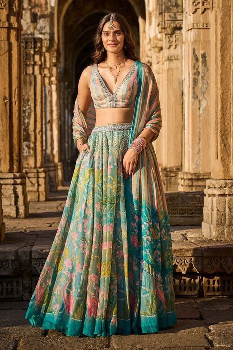 Buy washes of #blue and a colorful array of wild plants and #flamingo #prints bring this look together by #AnitaDongre at #Aza Fashions Shop online now at #Azafashions.com Call +91 8291990059 or email contactus@azafashions.com for enquiries. #wedding #festive #ethnic #tradional #shopping #shoponline #party #reception #bride Lehenga Purple, Indian Outfits Lehenga, Wedding Lehenga Designs, Anita Dongre, Blue Lehenga, Indian Dresses Traditional, Indian Bridal Dress, Indian Gowns, Embroidered Wedding