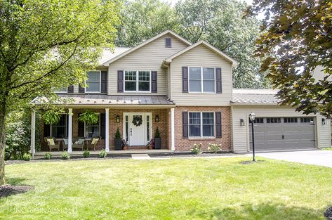 90s colonial exterior renovation with standing seam steel roof 1980s Colonial House Exterior, 1990 House Exterior, Exterior Colonial Makeover, 90s Colonial Exterior Remodel, Two Story Bay Window Exterior, Neo Colonial House Exterior, 2000s Home Exterior, 80's Houses Exterior, 1990s House Exterior