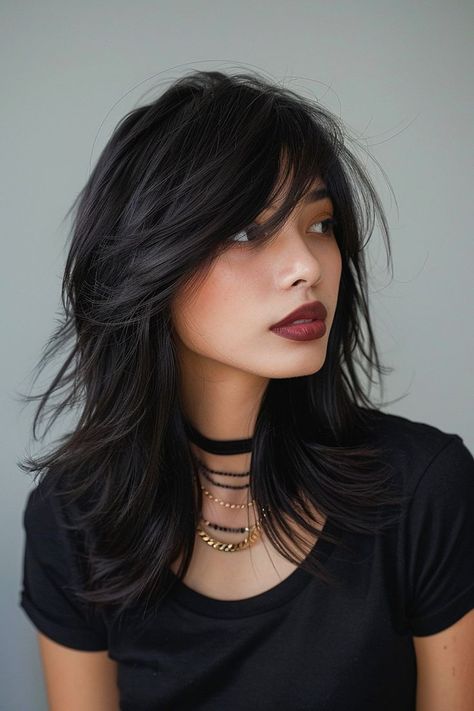 Edgy medium haircut with emo layers and bangs