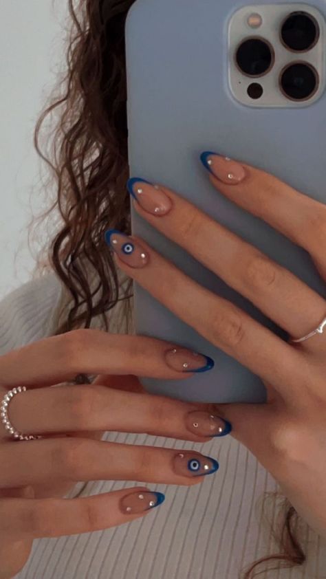 Short Almond Nails Evil Eye, Nail Art Ideas With Rhinestones, Nail Inspiration Rhinestones, Minimalist Nails With Rhinestones, 3rd Eye Nail Art, Eye Evil Nails, Evil Eye On Nails, Evil Eye Inspired Nails, Blue Eye Nail Art