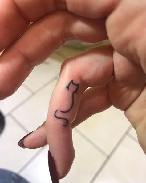 Cat tattoo Finger tattoo Cat On Finger Tattoo, Cat Finger Tattoos For Women, Small Cat Finger Tattoo, Finger Tattoos Cat, Black Cat Finger Tattoo, Cat Hand Tattoos For Women, Cat Tattoo On Finger, Black Cat Small Tattoo, Animal Finger Tattoo