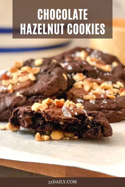 These Chocolate Hazelnut Thumbprint Cookies are fudgy, cakey, and decadently delicious, with a dollop of chocolate hazelnut spread in the center and sprinkled with toasted hazelnuts. A simple and easy sweet treat in less than 30 minutes, with no need for chilling the dough. Chocolate Hazelnut Cookies, 31 Daily, Hazelnut Cookies, Easy Sweets, Double Chocolate Cookies, Chocolate Crinkles, Chocolate Hazelnut Spread, Hazelnut Spread, Thumbprint Cookies