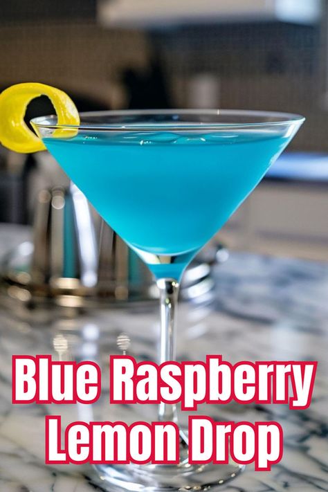 Delight in the sweet and tangy Blue Raspberry Lemon Drop, a vibrant and fun cocktail. Click to find out how to make this delicious drink! Blue Lemon Drop, Raspberry Vodka Drinks, Blue Alcoholic Drinks, Winter Vodka Cocktails, Raspberry Lemon Drop, Lemon Drop Recipe, Vodka Blue, Vodka Cocktails Easy, Lemon Drop Cocktail