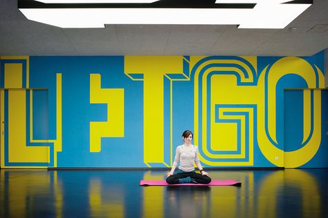 andreas uebele and his team kitted out a new adidas gym in germany with super-sized words and numbers that contain hidden meaning. Signage Design, Office Wall Graphics, Gym Interior, Office Branding, Environmental Graphic Design, Exhibition Display, Gym Design, Environmental Design, Environmental Graphics