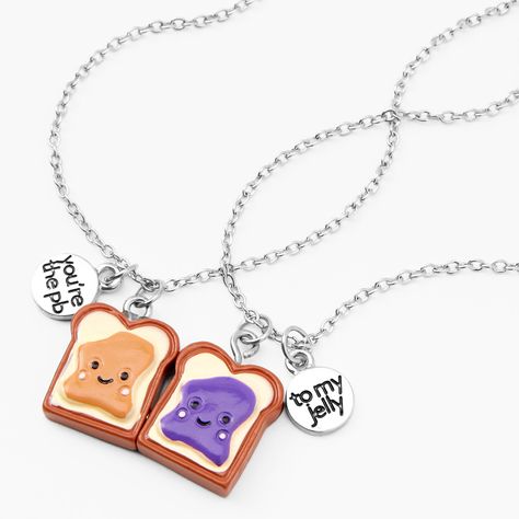 Find me a better duo. Show your love & admiration for your BFF with this pack of 2, dainty silver-tone necklaces, each equipped with a smothered slice! Slices of PB&J make up the design of this best friends pendant necklace set. Dangling next to each pendant, are silver-tone charms that read "You're the PB" "To my jelly" in whimsy lettering. Near or far, take a piece of your bestie wherever you may snack. Ideal for birthdays, or "just because" - gift this delicious friendship piece to th Best Friend Things Matching, Friendship Necklaces For 2 Friends, Bff Necklaces For 2 Best Friends, Cute Bff Jewelry, Bff Necklaces For 2 Magnetic, Friend Necklaces For 2, Best Friend Necklaces For 2 Unique, Matching Bff Necklaces, Bestie Necklaces For 2