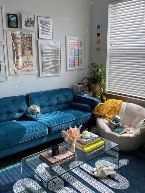 This Small Texas Rental Never Feels Dreary Thanks to Color and Disco Balls | Apartment Therapy Blue Couch Home Decor, Blue Couch Bedroom Ideas, Gallery Wall Blue Couch, Blue Aesthetic Living Room Ideas, Blue Aesthetic Interior Design, Living Room Design With Blue Couch, Area Rugs With Blue Couch, Blue White Apartment, Teal Velvet Couch Living Room