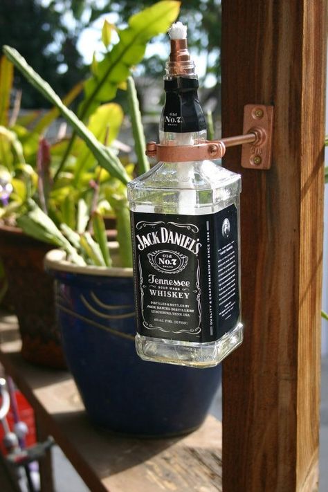 9 Ways To Repurpose Your Jack Daniel's Bottles, Because Showcasing Used Liquor Bottles On Your Shelf Was Only Cute In College Jack Daniels Lampe, Jack Daniels Lamp, Torches Tiki, Bartending 101, Empty Liquor Bottles, Wine Bottle Tiki, Wine Bottle Tiki Torch, Jack Daniels Bottle, Bottle Lamps