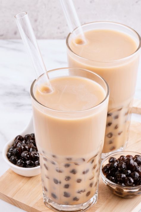 Why pick between coffee and tea when you may have both at the same time? This Hong Kong Style Yuanyang Coffee Milk Tea combines the two popular beverages into a delicious drink with a caffeine kick. It's great hot or cold! The term "Yuanyang" (also known as yuenyeung in Cantonese) means "Mandarin duck," and if you look at a photo of the male and female, you'll see they're pretty different. #coffee #drinks #milk #milktae Coffee Milk Tea Recipe, Instant Boba, Boba Kit, Bubble Tea Flavors, Coffee Milk Tea, Milk Tea Recipes, Sous Vide Recipes, Coffee Mix, Hong Kong Style