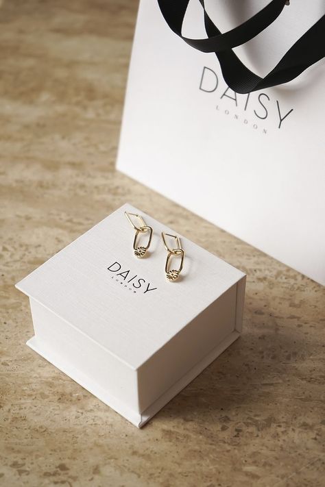 You can’t go wrong with a jewellery gift from Daisy London. Whether you’re looking for 18ct gold plated and 100% recycled sterling silver Daisy has the must-have piece for anyone you love. Make it extra special with our complimentary gift wrap and personalised gift notes. Elegant Gold Plated Jewelry With Logo Charm, Gold Plated Luxury Pearl Earrings As Gift, Elegant Gold Jewelry With Logo, Luxury Gold Plated Pearl Earrings For Gifts, Personalised Necklace Names, Daisy London, Jewelry Packaging Design, Hexagonal Ring, Rose Quartz Healing