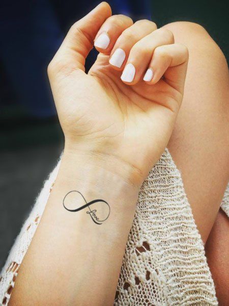 25 Cute Wrist Tattoos for Women in 2021 - The Trend Spotter Love Tattoo On Hand, Eternity Tattoo, Infinity Love Tattoo, Small Infinity Tattoos, Infinity Sign Tattoo, Infinity Tattoo On Wrist, Wörter Tattoos, Love Symbol Tattoos, Infinity Symbol Tattoo