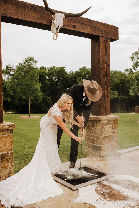 Western Wedding |  Cowboy Wedding | Texas Wedding Photographer | Boho Wedding | Madi Wagner Photography Country Honeymoon Ideas, Wedding Dresses That Look Good With Cowboy Boots, Western Isle Runner, Branding A Cowhide Rug Wedding, Wedding Branding Ceremony Cowhide, Cow Hide Branding At Wedding, Western Wedding Altar, Punchy Western Wedding, Western Wedding Dresses With Sleeves