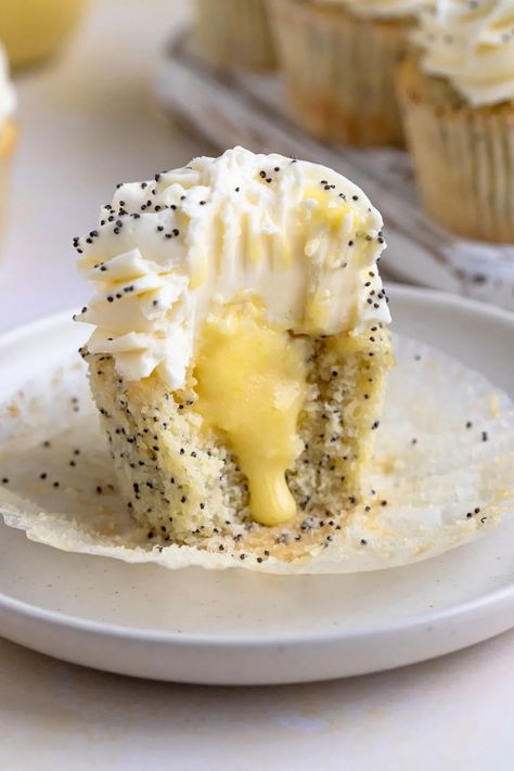 Lemon Poppy Seed Cupcakes with Lemon Curd Filling #lemon #lemoncurd #poppyseed #cupcake #baking #dessert #dessertrecipe | Bakes by Brown Sugar Lemon Poppy Cupcakes, Lemon Filled Cupcakes, Lemon Poppyseed Cupcakes, Poppyseed Cupcakes, Poppy Seed Cupcakes, Lemon Poppy Seed Cupcakes, Lemon Curd Cupcakes, Dessert Snacks, Curd Filling