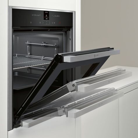 This stunning single oven from Neff is as functional as it is stylish. It features Neff’s unique Slide&Hide disappearing door which retracts smoothly under the oven cavity, allowing plenty of room for manoeuvring and easier access into the oven. It has an incredible 71 litre capacity, 12 cooking functions and the very innovative CircoTherm technology. Oven Cleaning Easy, Neff Oven, Steel Door Design, Steam Oven, Stainless Steel Oven, Single Oven, British Bake Off, Interior Clean, Electric Grill