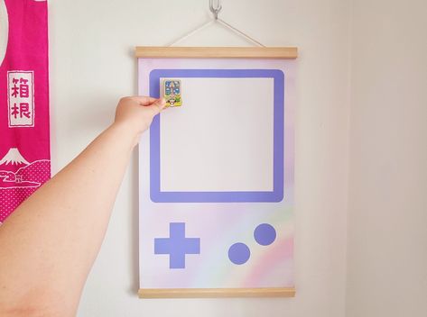 Purple Gameboy pin banner is a fun and stylish way to display your love of gaming. Perfect for gamers of all ages, this banner is made of high-quality pins and features a vibrant purple Gameboy design. Hang it on your wall, mantle, or anywhere else you want to show off your gaming pride! #gameconsole #gamer #gaming #gameroom . #Geeky_Living_Room #Patch_Display #Monster_Snacks #Banner_Game Sakura Snacks, Patch Display, Gamer Wall Decor, Monster Snacks, Geek Home Decor, Pin Banner, Pins Badge Display, Banner Game, Patches Display