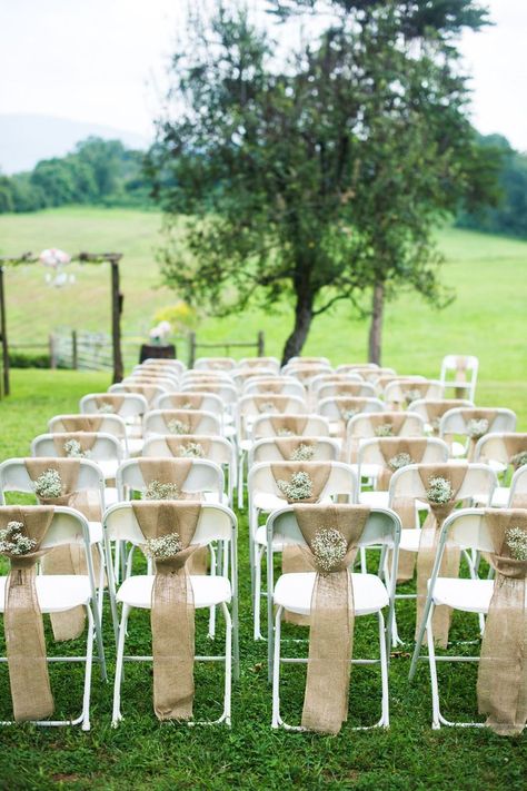 Inexpensive Folding Chairs: 16 Fabulous Ways to Decorate - CTC Event Furniture - CTC Event Furniture Wedding Ceremony Chairs, Rustic Burlap Wedding, Rustic Wedding Decorations, Ceremony Chairs, Wedding Chair Decorations, Chair Decor, Ceremony Seating, Burlap Wedding, Rustic Outdoor