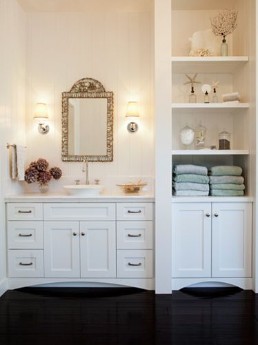 Margot Hartford Photography: chic white bathroom design with white overmount vessel sink, white bathroom cabinet vanity, Restoration Hardware Lugarno Single Sconces, mosaic tiles mirror, built-ins and glossy ebony wood floors. Bathroom Built Ins, Bathroom Linen Tower, White Bathroom Cabinets, White Bathroom Designs, Bathroom Closet, Bathroom Storage Shelves, Trendy Bathroom, Pink Bathroom, Bath Room