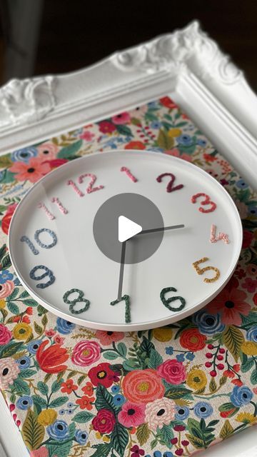 Lorrie Everitt Studio | Maker | Creator | DIYer on Instagram: "Embroidery on an IKEA clock!   Another DIY makeover project that I completed for my new studio space on the weekend. It was so fun to give this $3.99 IKEA wall clock a pretty makeover.   Looking for a unique, inexpensive, beginner embroidery project that you can create in an afternoon?  This is it! 🪡🧵  ✂️ Details:  1. The IKEA Tromma wall clock has punched holes that form the numbers and makes it ideal for embroidery.   2. I used twelve colours of DMC Pearl Cotton floss that match Rifle Paper Co’s Wildwood Petite Garden Party fabric.   3. I added straight stitches to the punched holes - and they looked perfectly fine. But I wanted to add a little more depth to the embroidery, so I weaved the embroidery floss between the strai Clock Makeover Diy, Wall Clock Makeover, Wall Clock Ikea, Embroidery Clock, Clocks Diy Crafts, Covered Cork Board, Ikea Clock, Fabric Covered Cork Board, Clock Makeover