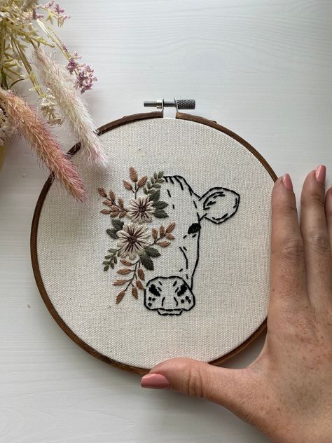 Cow's Head with Flowers Bohemian Style Embroidery Hoop 6" Wood Hoop - White linen This hoop is hand stitched by me and ready to ship! No two embroidery hoops will be exactly the same.   Standard shipping time applies. Head With Flowers, Farm Embroidery, Christian Embroidery, Simple Hand Embroidery Patterns, Boho Embroidery, Embroidery Lessons, Cow Head, Diy Embroidery Patterns, Flowers Embroidery