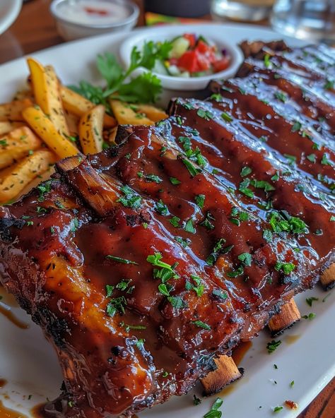 OVEN BAKED RIBS 🍖 Ingredients: 2 racks of pork ribs (baby back or spare ribs) 1/4 cup dry rub (your favorite blend or a mix of paprika, brown sugar, garlic powder, onion powder, salt, and black pepper) 1 cup barbecue sauce (optional, for glazing) Directions: Step 1: Prepare the Ribs Preheat your oven to 300°F (150°C). Remove the membrane from the back of the ribs and pat them dry with paper towels. Rub the dry rub mixture all over the ribs, covering both sides. Let them sit for at lea...