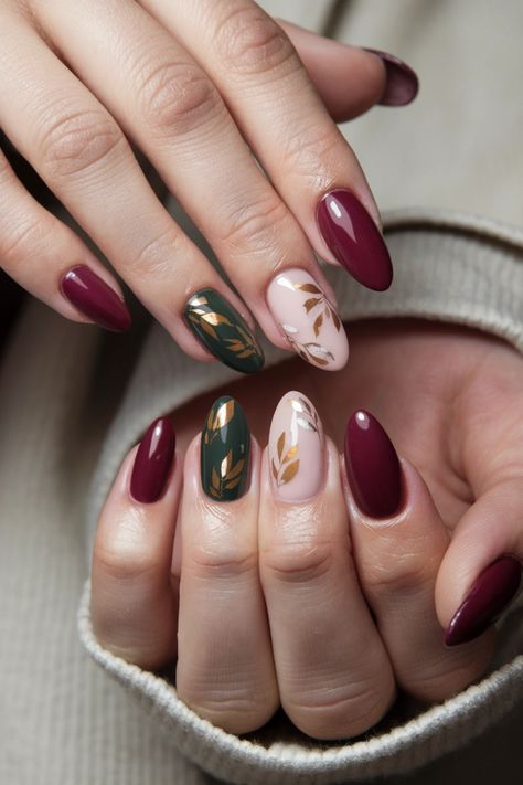 Embrace the beauty of the season with these fall nail ideas featuring mesmerizing gel nails adorned with intricate autumn leaves. The rich hues of red, orange, and gold encapsulate the essence of fall, making your nails a true seasonal statement. Perfect for cozy gatherings or weekend outings, these stunning gel nails will elevate your style while keeping your tips chip-free and glossy. Discover the magic of these fall nail ideas! #FallNailIdeas #GelNails #AutumnNails #NailArt Short Almond Nail Art Fall, Fall Leaf Designs For Nails, Colourful Autumn Nails, Gold Leaves Nails, Fall Jewel Tone Nails, Red And Gold Design Nails, Fall Leaves Nails Design, Olive And Gold Nails, Fall Nails Leaves Autumn