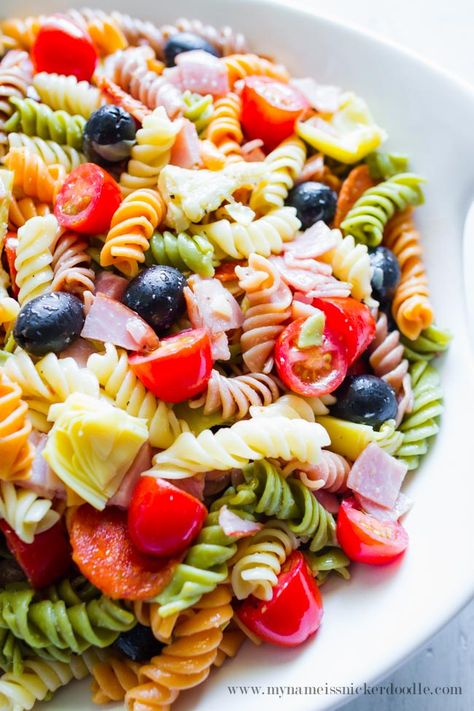 This Artichoke Pasta Salad is perfect for a summer side dish! | mynameissnickerdoodle.com Buttered Pasta, Snickerdoodle Recipes, Rainbow Pasta Salad, Artichoke Pasta Salad, Fruit Salad Ingredients, Spiral Noodles, Rainbow Pasta, Artichoke Pasta, Summer Side Dish