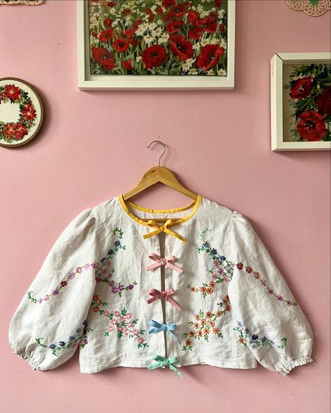 Linen floral blouse with rainbow bows 🎀 Another beauty made from vintage tablecloth with floral hand embroidery Rainbow bows on front… | Instagram Tablecloth Blouse, Upcycled Doilies, Doily Ideas, Embroidery Rainbow, Upcycle Vintage, Floral Hand Embroidery, Vintage Doilies, Rainbow Bow, Diy Christmas Ornament