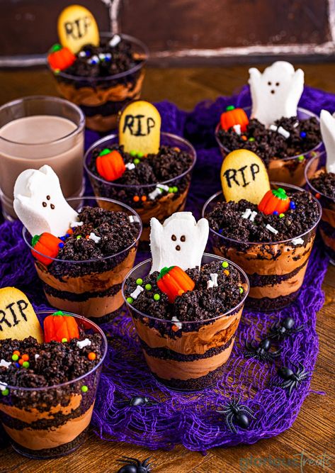 Halloween Graveyard Dirt Cups are just the cutest spooky treat for Halloween! A festive take on the traditional pudding dirt cup dessert, this version utilizes fun halloween candies and cookies decorated to look like tombstones! This adorable dessert is devilishly easy to make and will stand out on any treat table during the spooky season. // Glorious Treats Halloween Pudding Cups, Dirt Cakes, Dirt Cups Dessert, Halloween Pudding, Dirt Cups Recipe, Dirt Pudding Cups, Pudding Cup Recipes, Chocolate Pudding Cups, Dirt Dessert