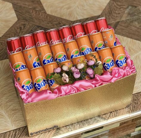 Soft Drinks wrapped in a gold box with pink satin for engagement dowry wrapping. Ghana Engagement Items Wrapping, Engagement Wrapping Ideas, How To Wrap Engagement Items In Ghana, Drinks Gift Basket, Engagement Wrapping Ideas Ghana, Engagement Hamper Ideas For Groom, Drink Gift Basket, Traditional African Wedding, Engagement Gift Baskets