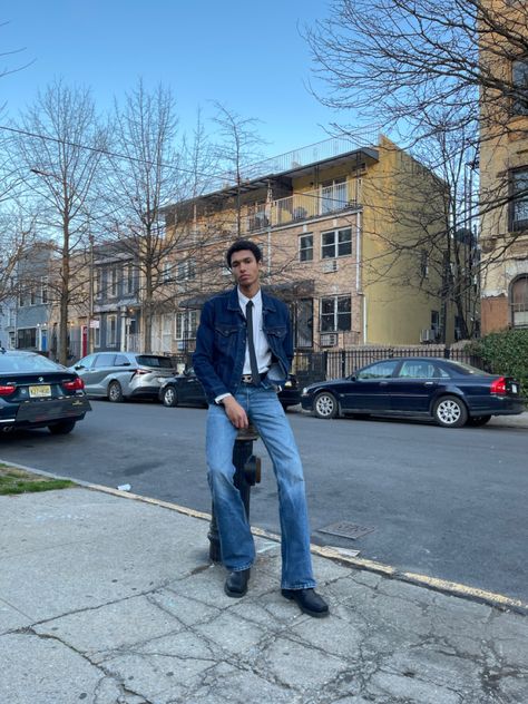 Lightskin model guy wearing an outfit with flare jeans pants, white shirt, jeans top, diesel belt and balck tie and boots Casual Tie Outfit, Work Shirt Outfit, Shirt And Tie Outfits, Tie Outfits Men, Diesel Belt, Denim Pants Outfit, Pant Flare, Denim Outfit Men, Flare Jeans Outfit