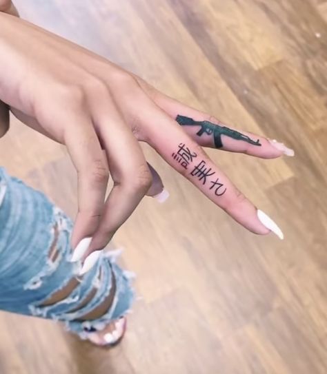 Gang Tattoos Female, Tattoo Ideas Female Gangsta, Trap Hand Tattoos, Gangsta Finger Tattoos, Gangster Tattoos For Women, Bhad Bhabie Hand Tattoos, Thug Tattoos For Women, Gangster Girl Tattoo, Small Dope Tattoos