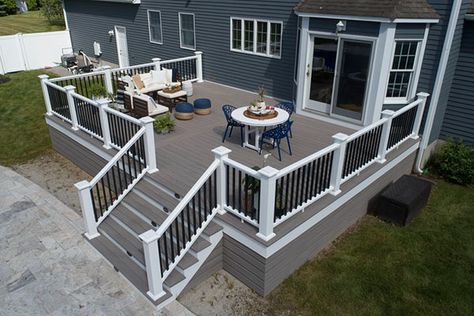 Deck Design Ideas to Spark Your Imagination | TimberTech Front Of Deck Landscaping, Beach House Deck Railing, Blue House With Deck, Outdoor Deck Design Ideas, Grey Decking Ideas, Trek Deck Ideas, Deck Ideas Off Back Of House, Front Deck Ideas, Wood Deck Ideas