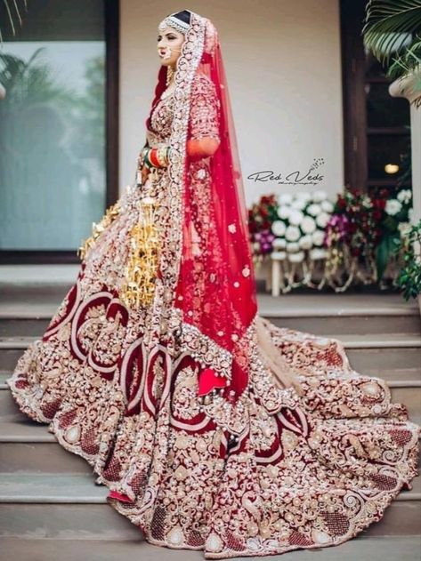 Looking for Long trail Bridal Lehengas ? Check out more such bridal fashion inspiration on the blog. Click on the link attached below.    #indianweddings #shaadisaga #intimateweddings #bridalfashion #bridallehenga #longtraillehenga #indianweddingtrends #extraordinarylehenga #indianbridaltrends #elegantlehenga शादी की तस्वीरें, Lehenga Bridal, Red Bridal Dress, Bridal Dupatta, Bridal Photography Poses, Indian Bridal Photos, Wedding Lehenga Designs, Bridal Lehenga Collection, Indian Wedding Photography Poses