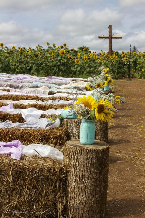 hay bales, painted mason jars and a rugged cross were some of the DIY decor elements my daughter envisioned for her wedding in a sunflower field Hay Bale Wedding Decorations, Pasture Wedding, Hay Bale Decorations, Hay Bale Wedding, Loving Vincent, Rugged Cross, Sunflower Themed Wedding, Field Wedding, Cowboy Wedding