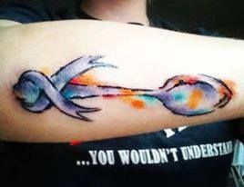 woman with spoon tattoo on her arm Chiari Malformation Tattoos, Spoon Theory Tattoo, Spoonie Tattoo, Spoon Tattoo, Crohns Tattoo, Purple Butterfly Tattoo, Awareness Tattoo, Ribbon Tattoos, Stomach Tattoos