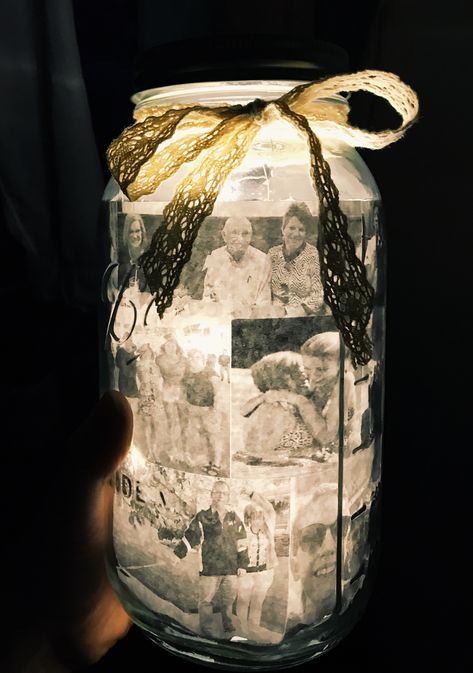 DIY half gallon mason jar lined with pictures, filled with fairy lights and tied with a lace bow. Mason Jar Memorial Ideas, Mason Jar Photo Ideas, Mason Jar Birthday Gift Ideas, Mason Jar Picture Ideas, Diy Memorial Gifts Creative Crafts, Half Gallon Mason Jar Ideas, Jars With Lights Inside Diy, Diy Fairy Lights Jar, Mason Jar Fairy Lights Diy